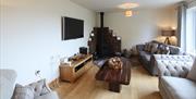Lounge and wood burners in holiday lodges at Hillcroft Park Holiday Park in Pooley Bridge, Lake District