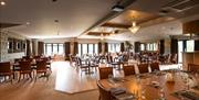 Ballroom set with multiple tables for a private event at Heather Glen Country House in Ainstable, Cumbria © Al Topping