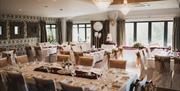 Room set for a wedding breakfast at Heather Glen Country House in Ainstable, Cumbria