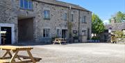 Outdoor seating and courtyard at Corner Cottage at Brackenthwaite Farm near Arnside, Cumbria