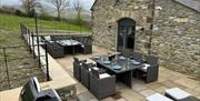 Outdoor seating at Moss Foot Holiday Home in Firbank, Cumbria