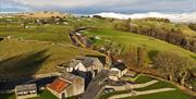 Aerial photo of Moss Foot Holiday Home and surrounding fields in Firbank, Cumbria