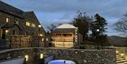 Outdoor hot tubs at Moss Foot Holiday Home in Firbank, Cumbria