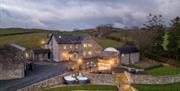 Exterior and drive at Moss Foot Holiday Home in Firbank, Cumbria