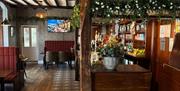 Bar and inside seating at The Ratty Arms in Ravenglass, Cumbria