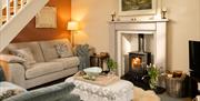 Living room with wood burner of Cocker Lane from Classic Cottages in the Lake District, Cumbria