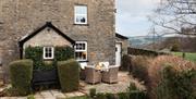 Exterior and outside seating in Hill Top Cottage from Classic Cottages in the Lake District, Cumbria