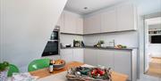Kitchen and dining area at Lowther Castle Cottage from Classic Cottages in the Lake District, Cumbria