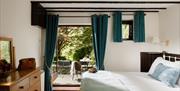 Double bedroom and balcony at Maple Cottage from Classic Cottages in the Lake District, Cumbria