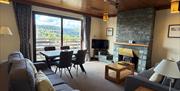 Living room with wood burner at The Lakelands Self-Catered Apartments in Ambleside, Lake District