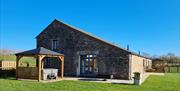 Exterior and hot tub at Low Ploughlands Holiday Lets in Little Musgrave, Cumbria