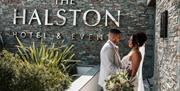 Bridal couple poses for a photo at The Halston in Carlisle, Cumbria © Kayley Greenall