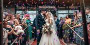 Bridal couple poses for a photo at The Halston in Carlisle, Cumbria