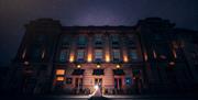 Nighttime exterior photo of a bridal couple at The Halston in Carlisle, Cumbria
