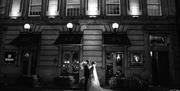 Bridal Couple posing for a photo in front of The Halston in Carlisle, Cumbria