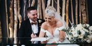 Bridal couple poses for a photo at The Halston in Carlisle, Cumbria