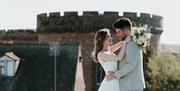 Bridal Couple posing for a photo near The Halston in Carlisle, Cumbria