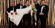 Bridal party poses for a photo at The Halston in Carlisle, Cumbria