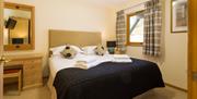 Double bedroom inside a lodge at Keswick Bridge in Keswick, Lake District