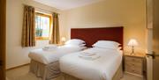 Twin bedroom inside a lodge at Keswick Bridge in Keswick, Lake District