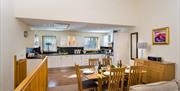 Kitchen and dining area inside a lodge at Keswick Bridge in Keswick, Lake District
