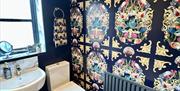 Shower room with wallpaper in La Petite Mews from Muddy Boots Escapes in Kirkby Stephen, Cumbria