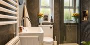 Bathroom with shower in Scarpa from Muddy Boots Escapes in Kirkby Stephen, Cumbria