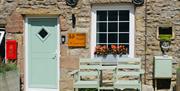 Entrance to Arcade Royale from Muddy Boots Escapes in Kirkby Stephen, Cumbria