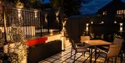 Garden seating at night in La Petite Mews from Muddy Boots Escapes in Kirkby Stephen, Cumbria
