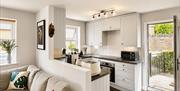 Kitchen and living room in Scarpa from Muddy Boots Escapes in Kirkby Stephen, Cumbria