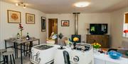 Kitchen appliances and living room in Scarpa from Muddy Boots Escapes in Kirkby Stephen, Cumbria