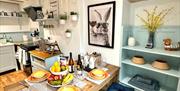 Kitchen and dining table in Arcade Royale from Muddy Boots Escapes in Kirkby Stephen, Cumbria