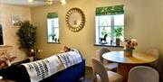 Living and dining room at La Petite Mews from Muddy Boots Escapes in Kirkby Stephen, Cumbria