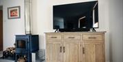 Log burner and TV in Scarpa from Muddy Boots Escapes in Kirkby Stephen, Cumbria