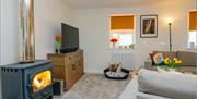 Log burner and living room in Scarpa from Muddy Boots Escapes in Kirkby Stephen, Cumbria
