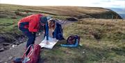 Visitors on a guided walk with South Lakes Adventures in the Lake District, Cumbria