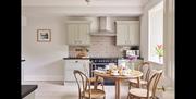 Kitchen and breakfast table at Rosetrees at The Lingholm Estate in Portinscale, Lake District