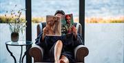 Visitor Reading at The Spa at Low Wood Bay Resort in Windermere, Lake District