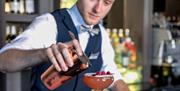 Staff member making a cocktail at Bartons Yard at The Halston in Carlisle, Cumbria © Phil Rigby Photography