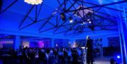 Speaker on stage at an event at The Halston in Carlisle, Cumbria
