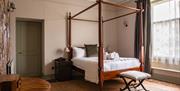 Bedroom with four poster bed at Rothay Garth B&B in Ambleside, Lake District