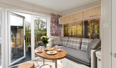 Living area inside a caravan at Newby Bridge Country Caravan Park