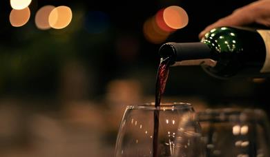 Wine being poured at The Five O'Clock Club at Bartons Yard at The Halston in Carlisle, Cumbria