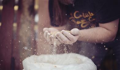 Brewer with Malt at Carlisle Brewing Co. in Carlisle, Cumbria