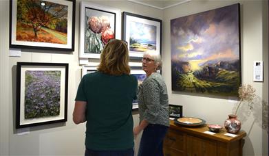 Visitors viewing Art on Display at Gallery North West in Brampton, Cumbria