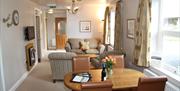 Lounge and dining area in Bannerdale at Near Howe Cottages in Mungrisdale, Lake District