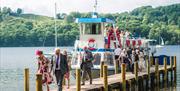 Wedding Guests Disembarking from a Windermere Lake Cruises Vessel in the Lake District, Cumbria