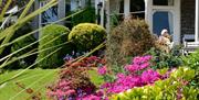 Garden and flowers in bloom at Clare House Hotel in Grange-over-Sands, Cumbria