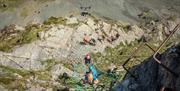 Climbers at Via Ferrata Xtreme at Honister Slate Mine in Borrowdale, Lake District