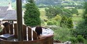 Hot tub with a view at Manesty Holiday Cottages in Manesty, Lake District